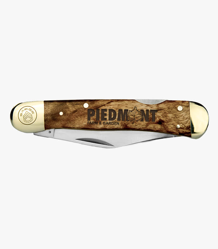 Closed front of Nickelback burl knife engraved with logo
