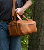 Leather range bag can hold ear and eye protection, ammo, and much more