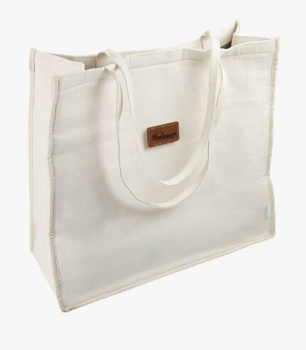 Front of Canvas Beach party tote bag engraved with logo